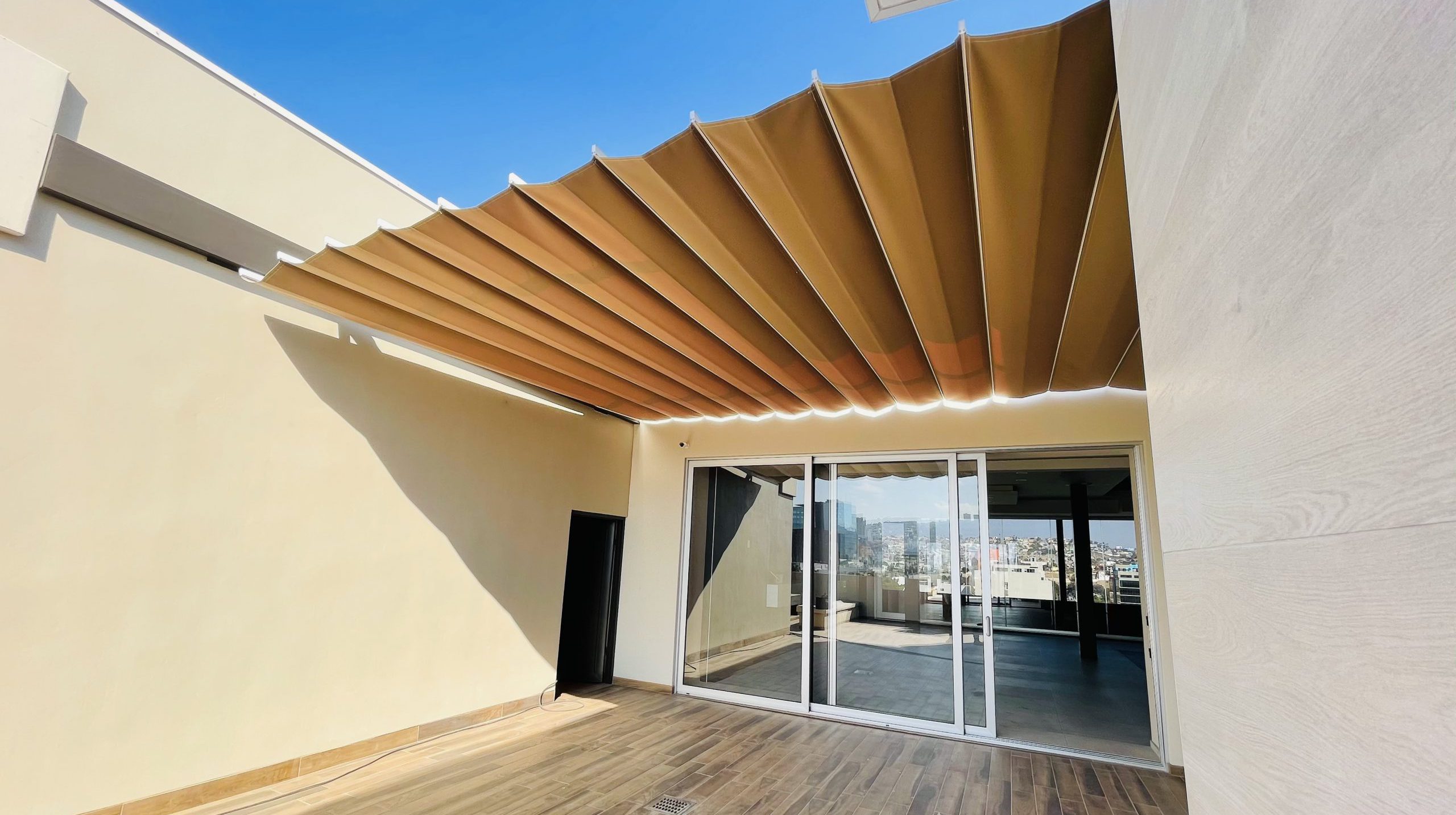 A wooden door with a canopy, or awning, providing shade and protection from the elements.